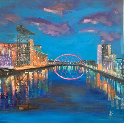 Electric Blue on the Clyde featuring Glasgow’s illuminated Clyde Arc over the River Clyde at night.